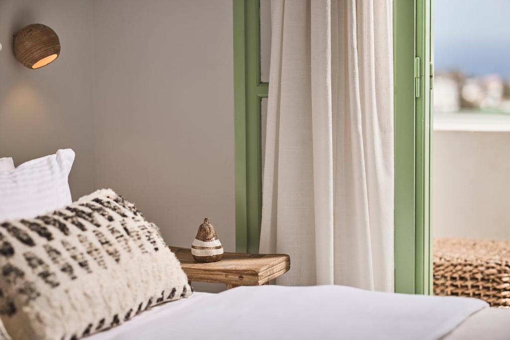 Łóżko lub łóżka w pokoju w obiekcie Antamoma Suites