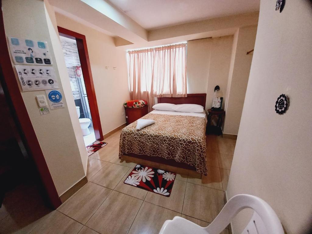 Postel nebo postele na pokoji v ubytování Hostal Oro Orense