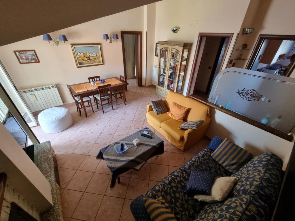 a living room with a couch and a table at CasAvelia in Scalea