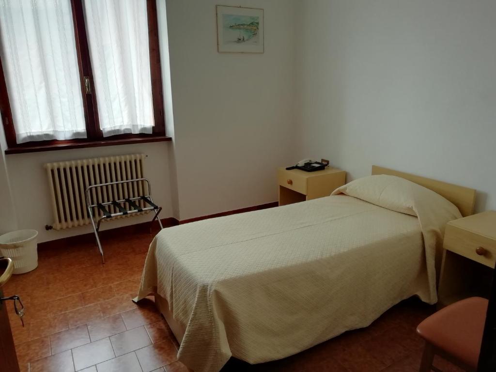 Postel nebo postele na pokoji v ubytování Albergo Breglia