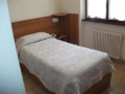 Postel nebo postele na pokoji v ubytování Albergo Breglia