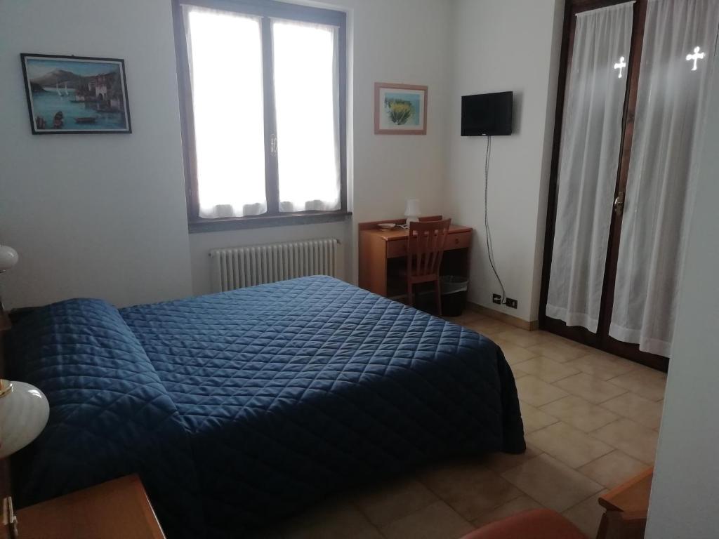 Postel nebo postele na pokoji v ubytování Albergo Breglia