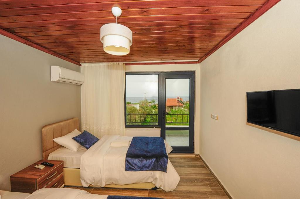 Postel nebo postele na pokoji v ubytování Assos No9 Hotel