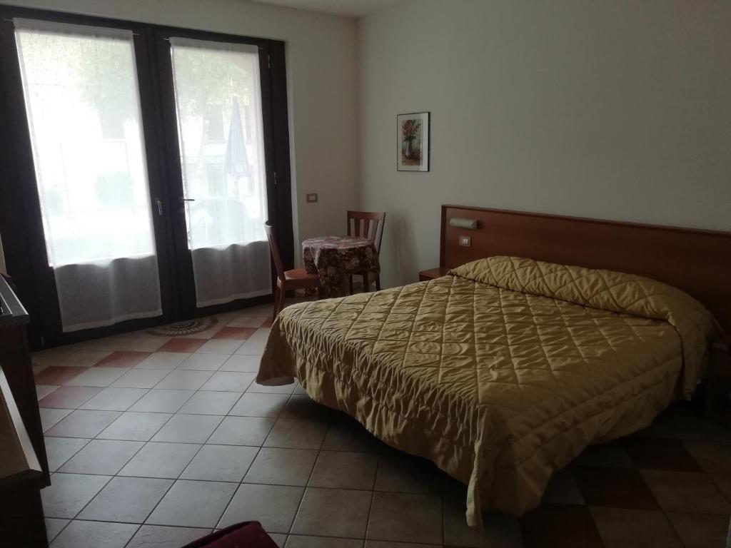 Postel nebo postele na pokoji v ubytování Albergo Breglia