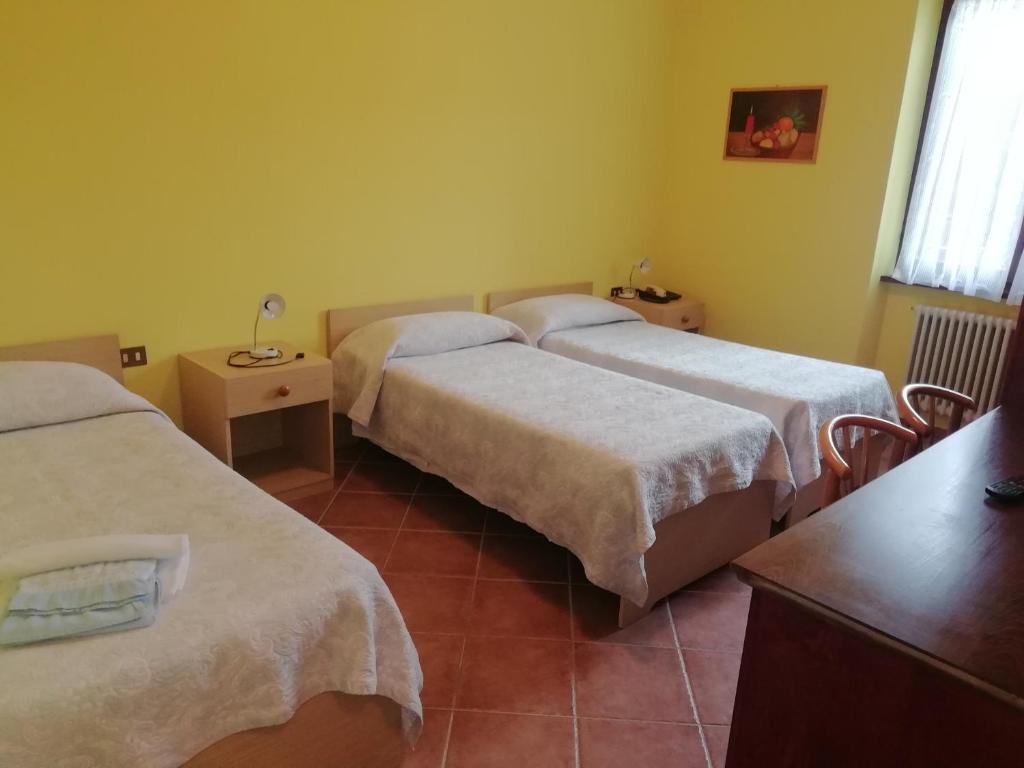 Postel nebo postele na pokoji v ubytování Albergo Breglia