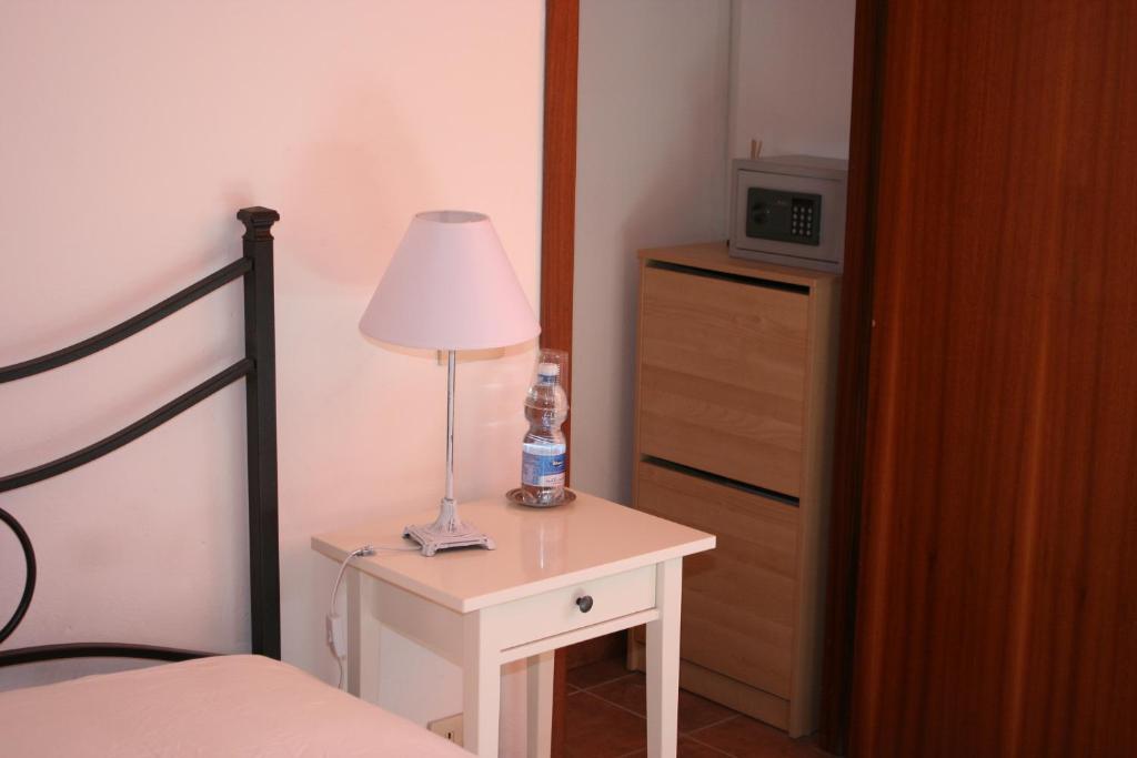 A bed or beds in a room at Il Giardino Nel Parco R&B