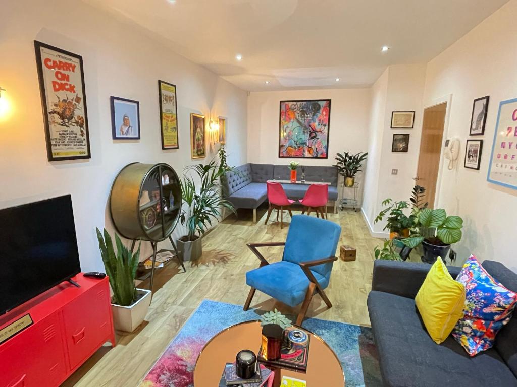 a living room with a couch and a tv at Award Winning Apartment in Yarm, North Yorkshire in Yarm