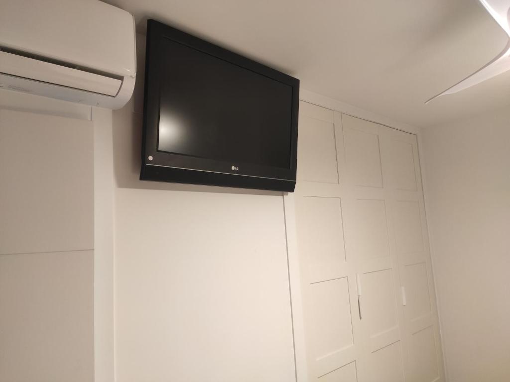 A television and/or entertainment centre at BEACHFRONT -- NEW LUXURY Apartment -- 1ª Linea Playa -- Fuengirola CITY CENTER -- Private PARKING -- Panoramic Sea Views --