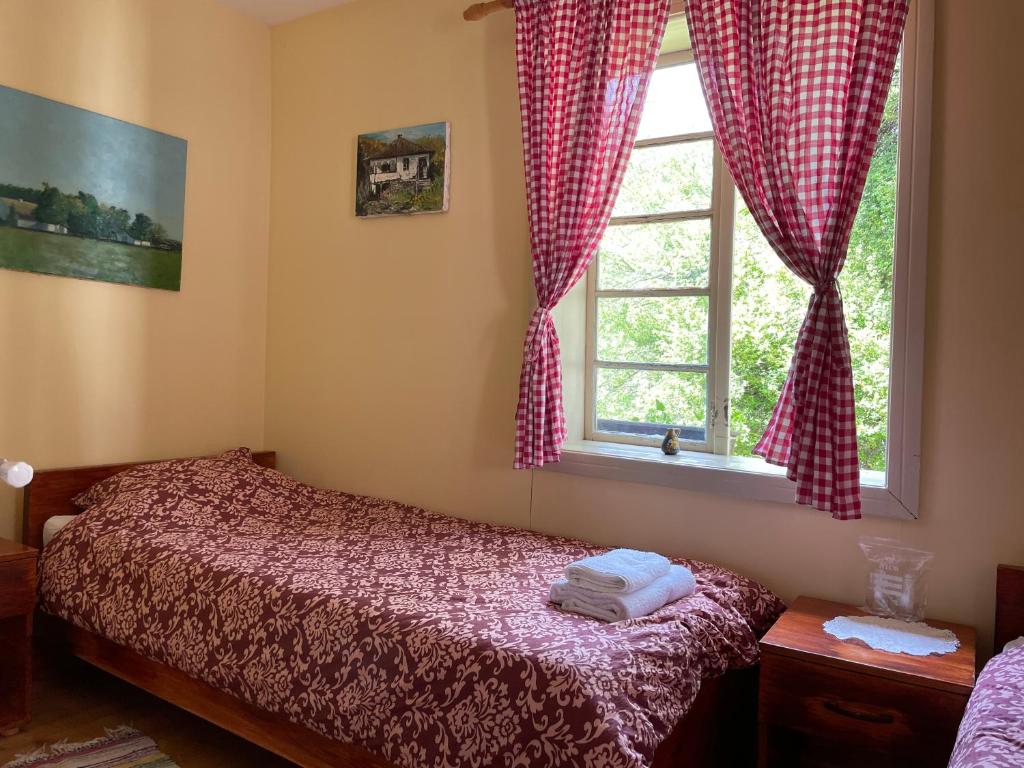Postel nebo postele na pokoji v ubytování Ethno Village Slatkovac