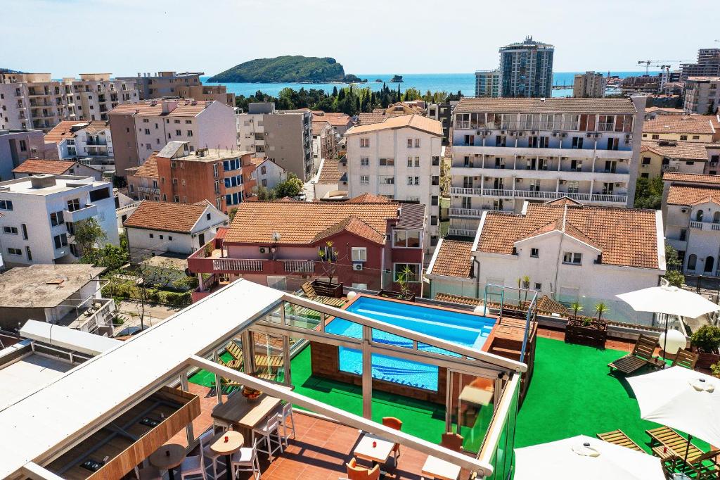 arial view of a city with a pool and buildings at Villa Skyprime in Budva