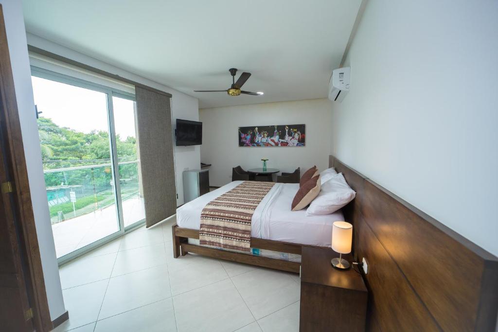 Postel nebo postele na pokoji v ubytování Hotel Ribera Sinu