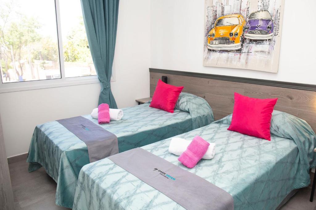 Postel nebo postele na pokoji v ubytování Hotel Oasis-Dream Holidays - La Petite France