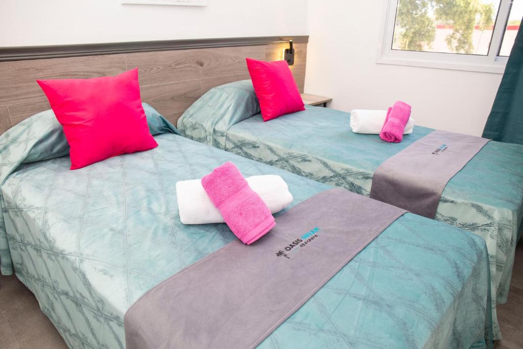 Postel nebo postele na pokoji v ubytování Hotel Oasis-Dream Holidays - La Petite France