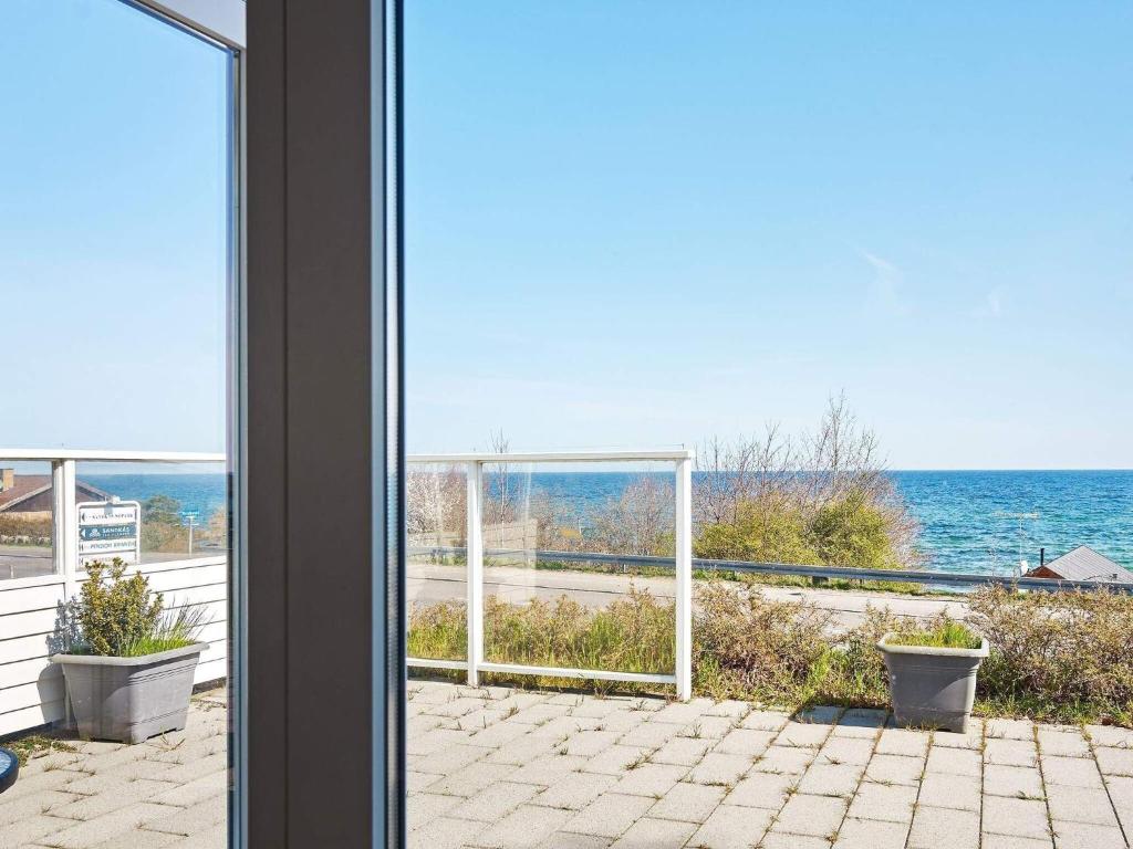 a view of the ocean from a house at Holiday home Allinge XXII in Allinge