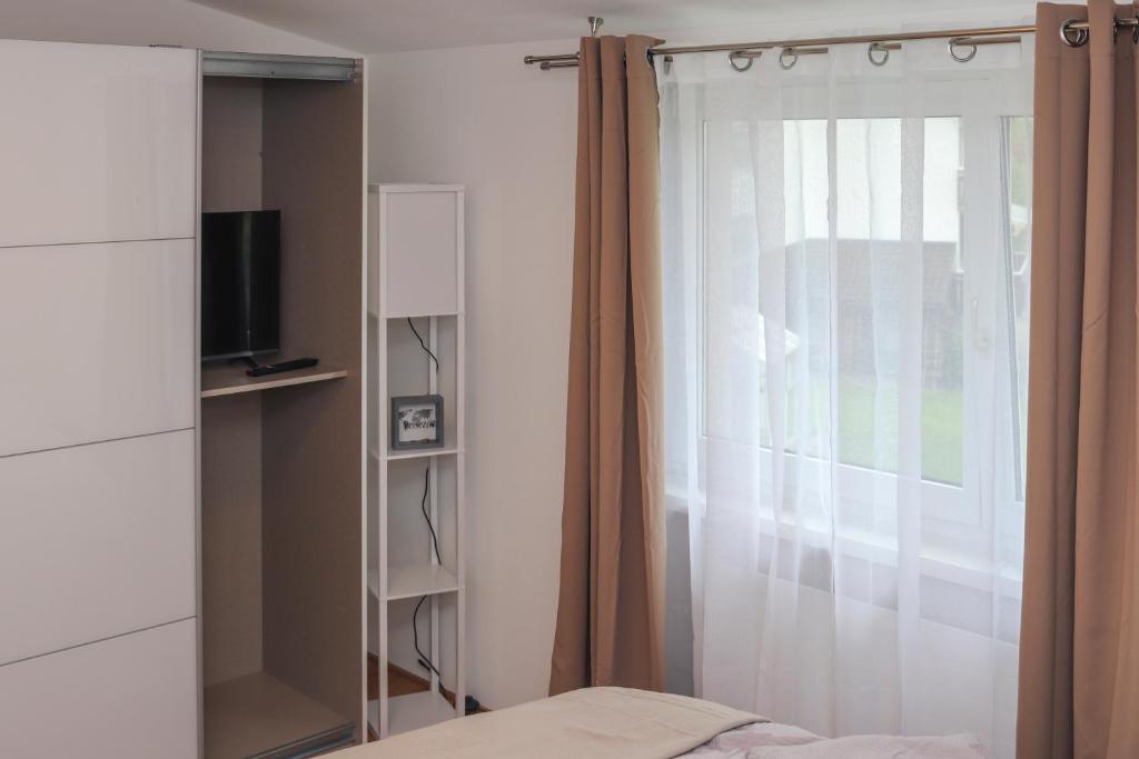 TV a/nebo společenská místnost v ubytování Ferienwohnung Melcher