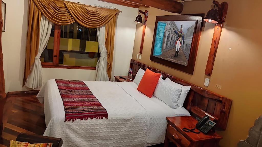 Postel nebo postele na pokoji v ubytování Hotel Maderanegra By Huasicama