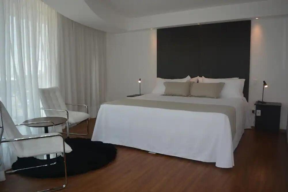 Postel nebo postele na pokoji v ubytování Don Hotel
