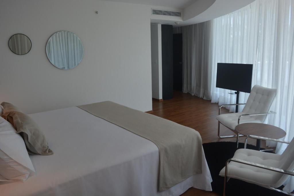 Postel nebo postele na pokoji v ubytování Don Hotel