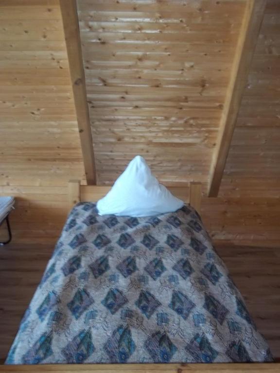 Postel nebo postele na pokoji v ubytování Kempings Ozianna