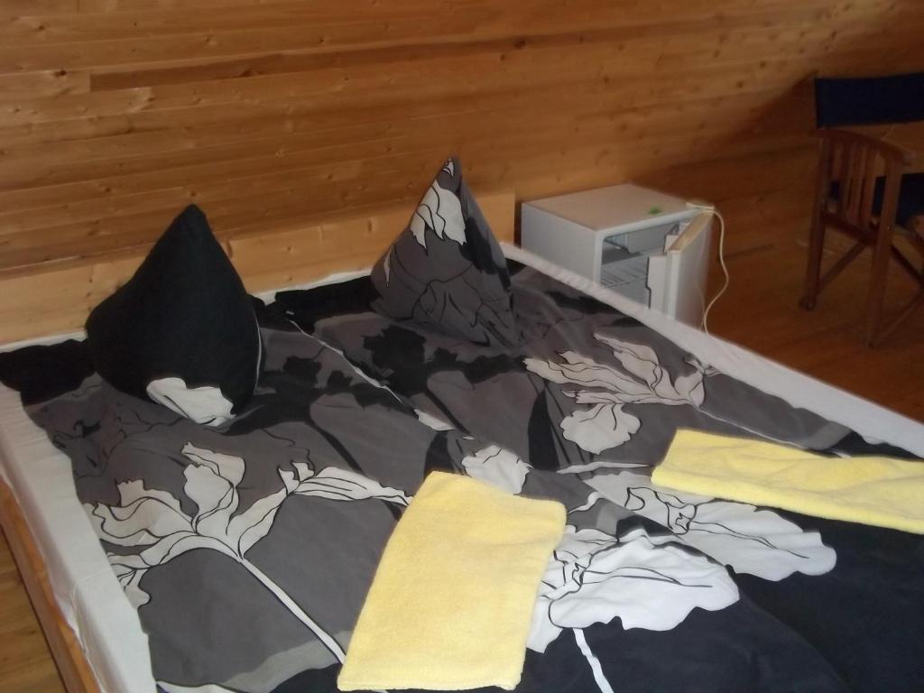 Postel nebo postele na pokoji v ubytování Kempings Ozianna