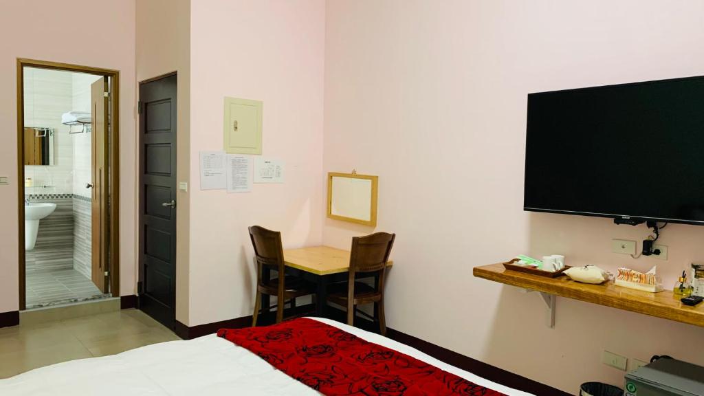 TV a/nebo společenská místnost v ubytování Yuan Homestay
