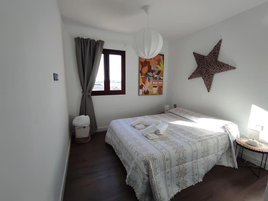 Postel nebo postele na pokoji v ubytování ATALAYA SUNSET terrazza panoramica privata con vista al mare