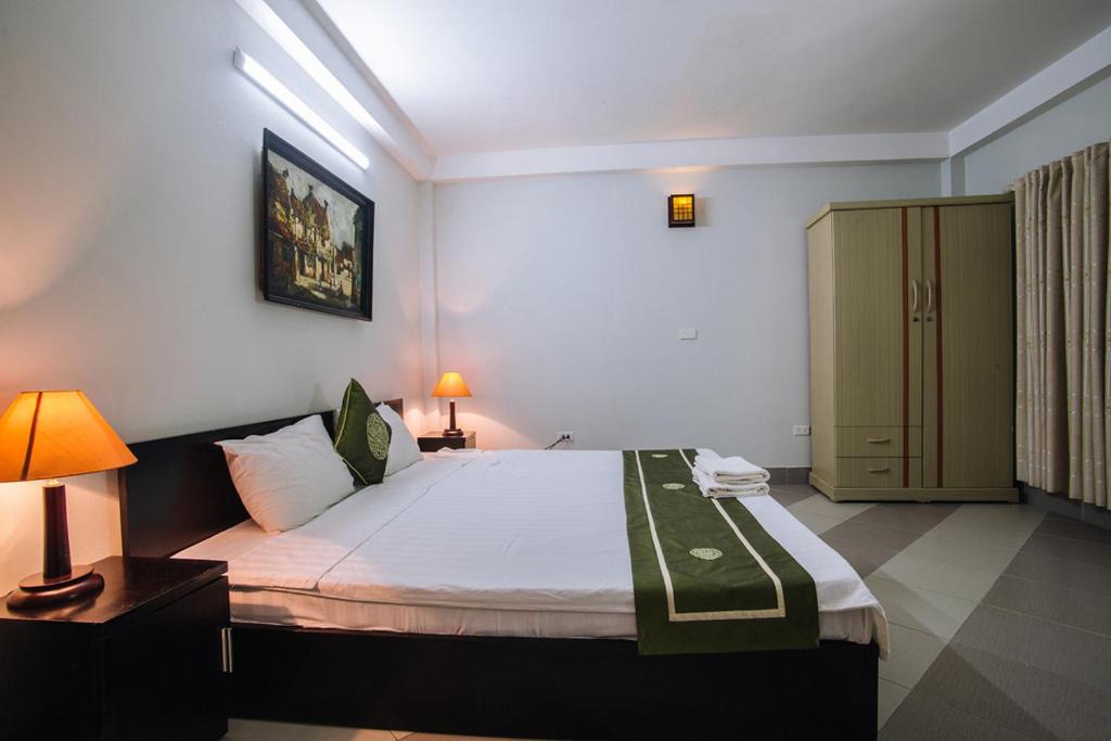 Postel nebo postele na pokoji v ubytování Joye Hotel
