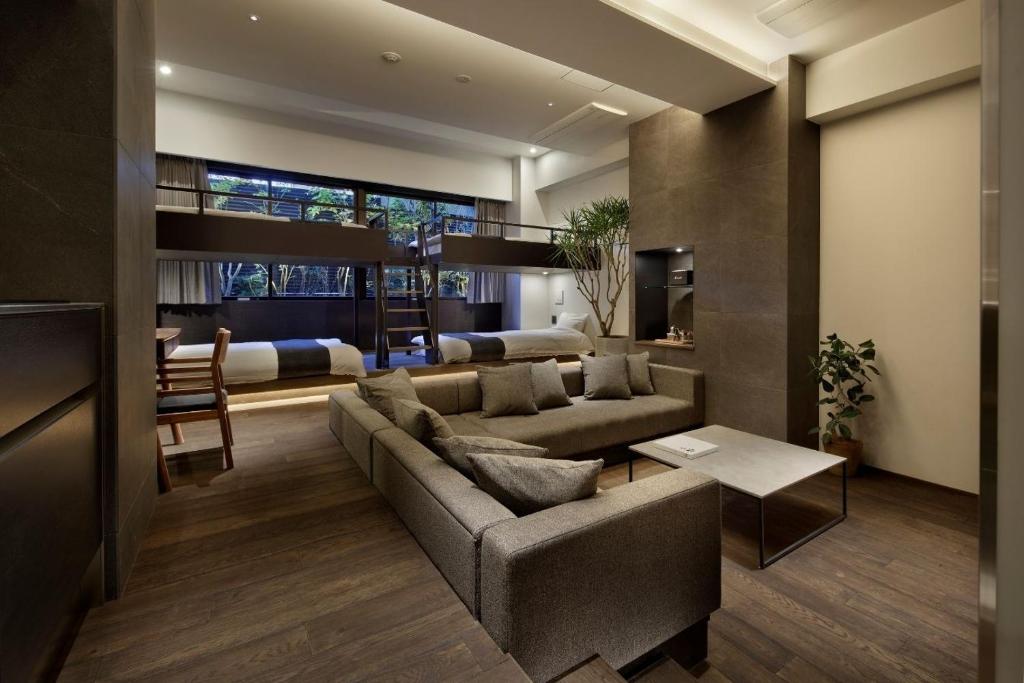 a living room with a couch and a table at 20 PIECES in Kyoto