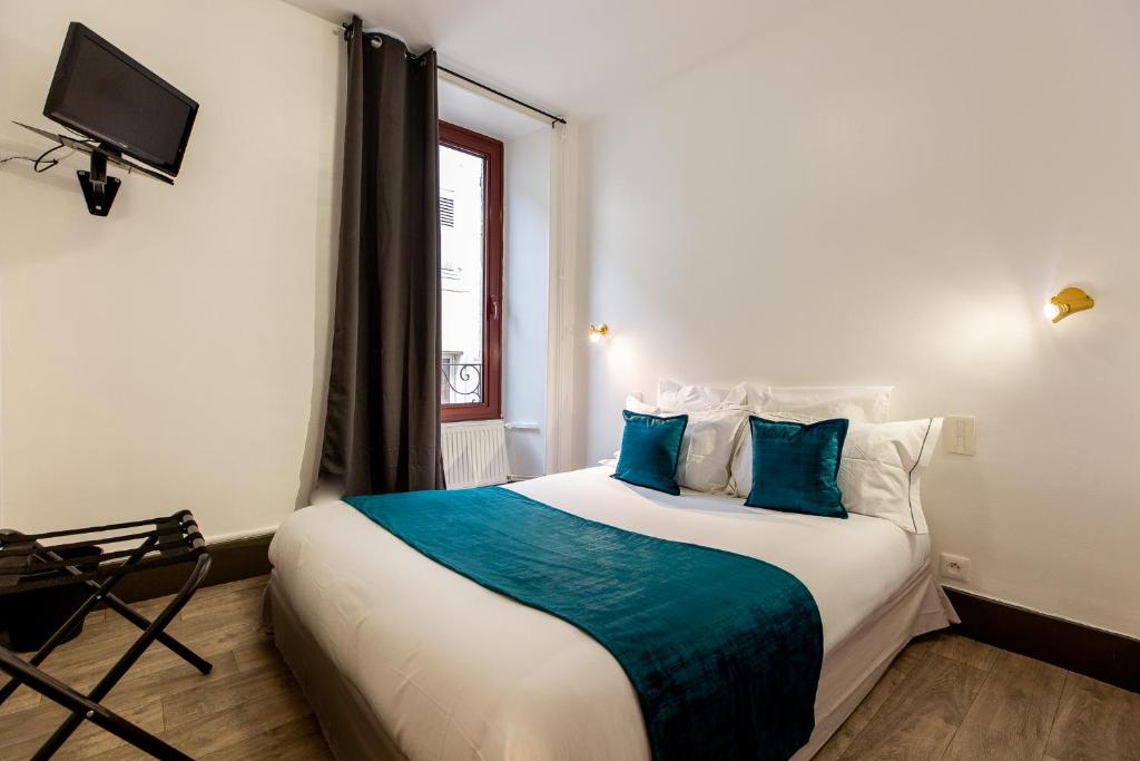 Postel nebo postele na pokoji v ubytování Grand Hôtel 1899