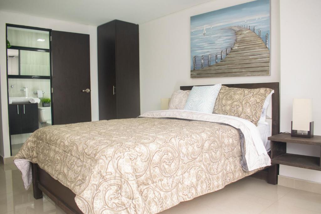 Postel nebo postele na pokoji v ubytování Apartahotel Kelly