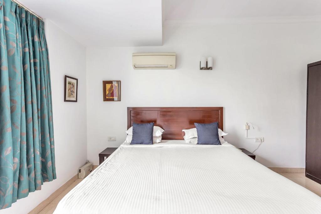 Postel nebo postele na pokoji v ubytování Arotel Rooms & Suites Calangute