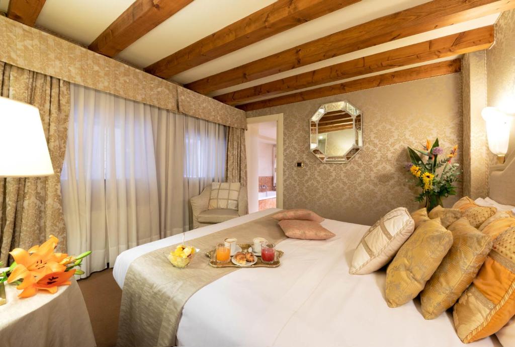 Łóżko lub łóżka w pokoju w obiekcie Duodo Palace