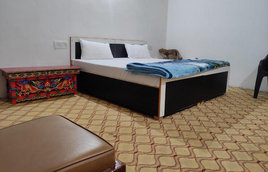 En eller flere senger på et rom på Buddha guest House nubra
