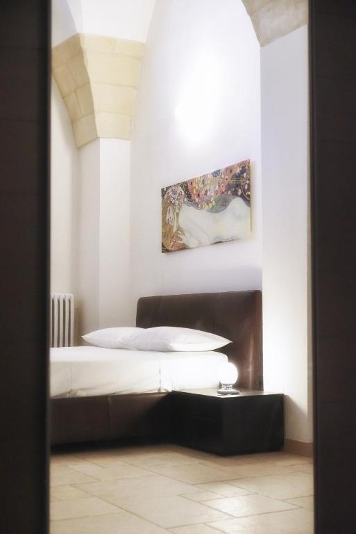 Posteľ alebo postele v izbe v ubytovaní Milestone Inn Lecce