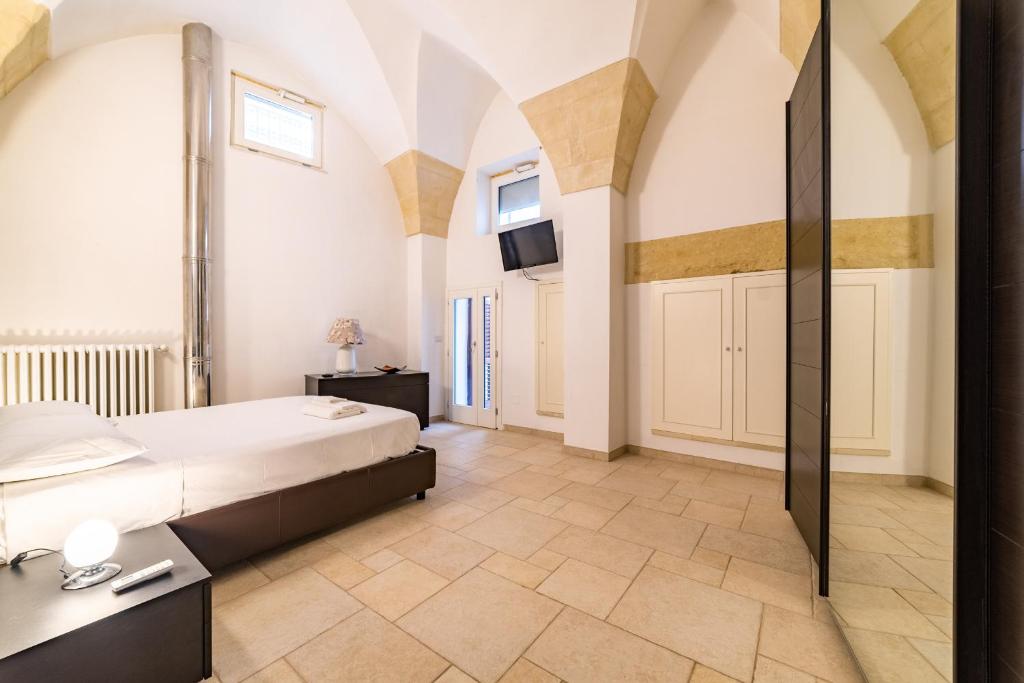 Posteľ alebo postele v izbe v ubytovaní Milestone Inn Lecce