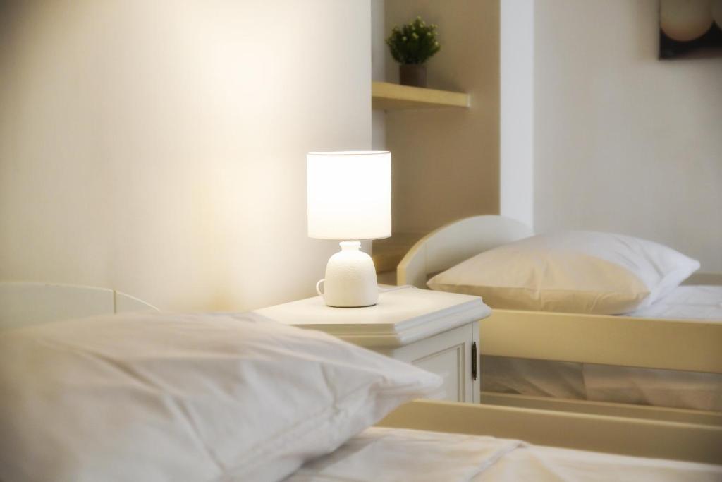 Posteľ alebo postele v izbe v ubytovaní Milestone Inn Lecce