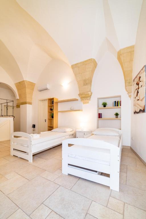 Posteľ alebo postele v izbe v ubytovaní Milestone Inn Lecce