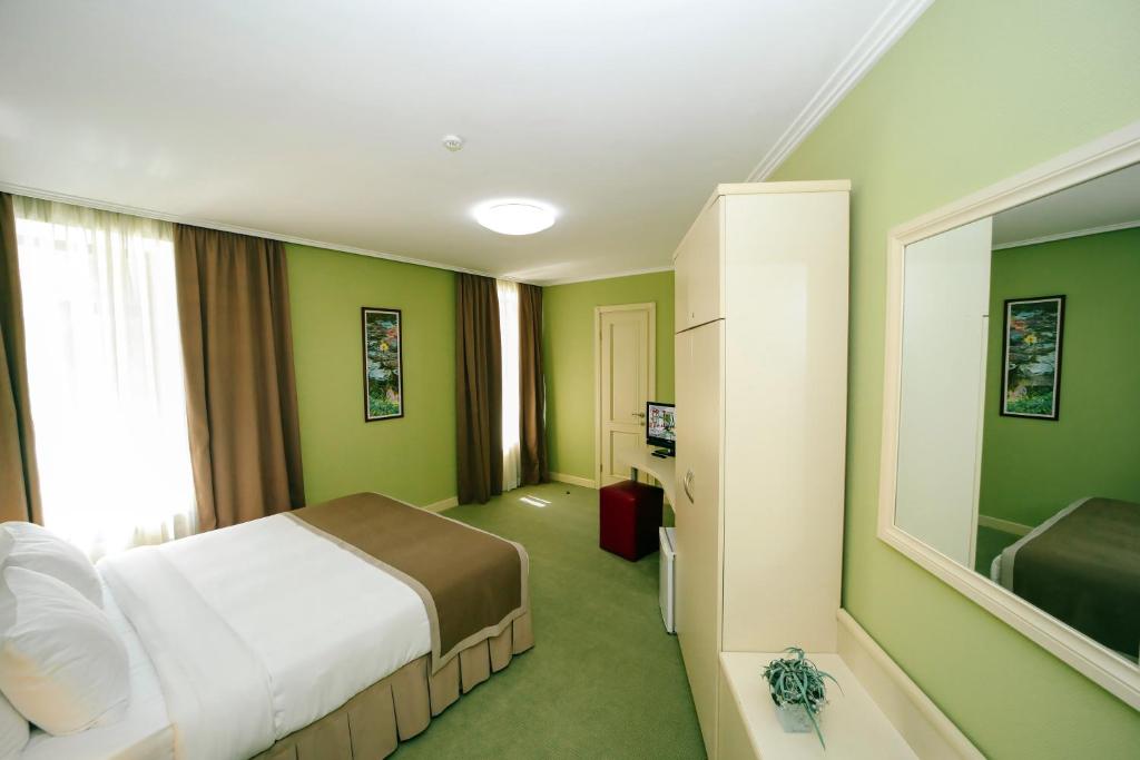 Postel nebo postele na pokoji v ubytování Sharden Villa Boutique Hotel