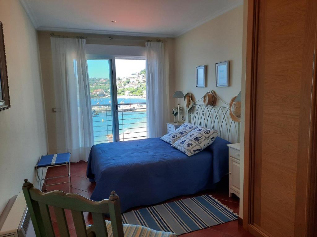 Posteľ alebo postele v izbe v ubytovaní Exclusivo apartamento en Raxó ( Sanxenxo)