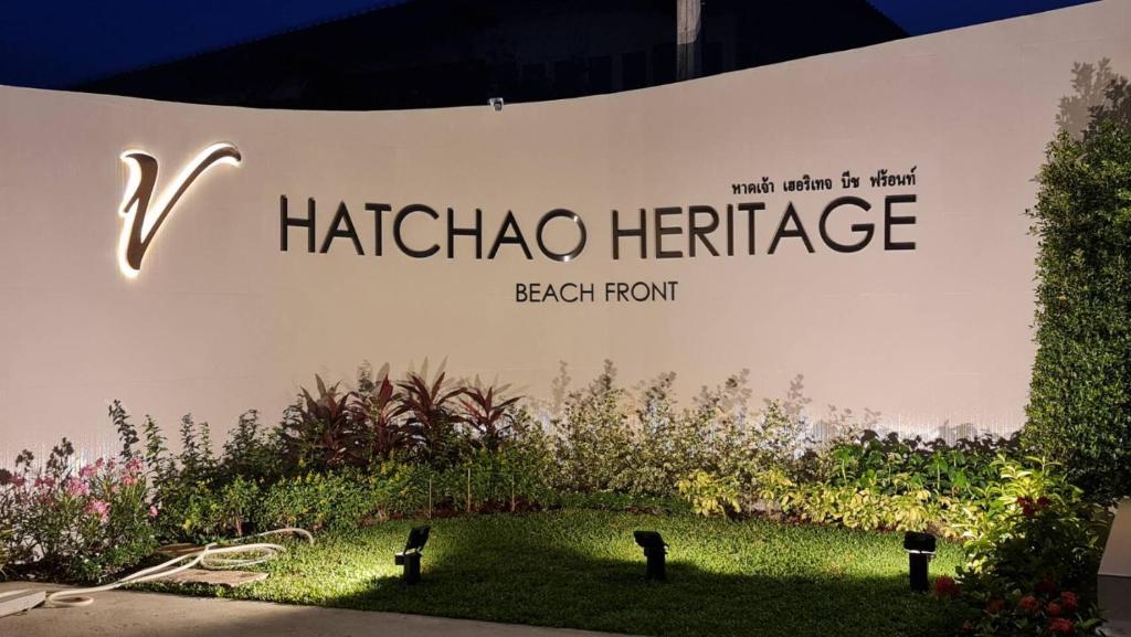 a sign for a hacienda heritage beach front at HATCHAO HERITAGE BEACH FRONT RESORT in Ban Hat Cha Samran