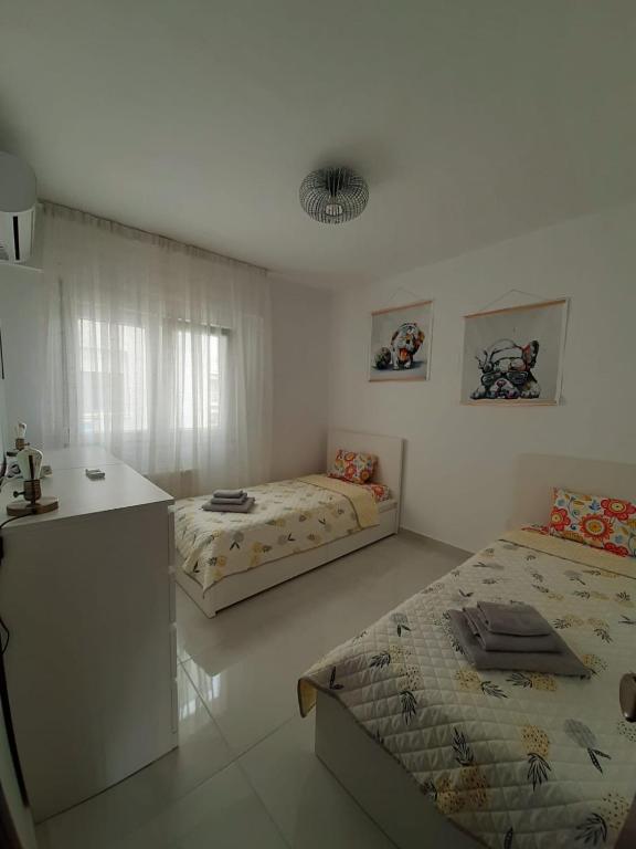 Postel nebo postele na pokoji v ubytování Appartement in Kallikratia