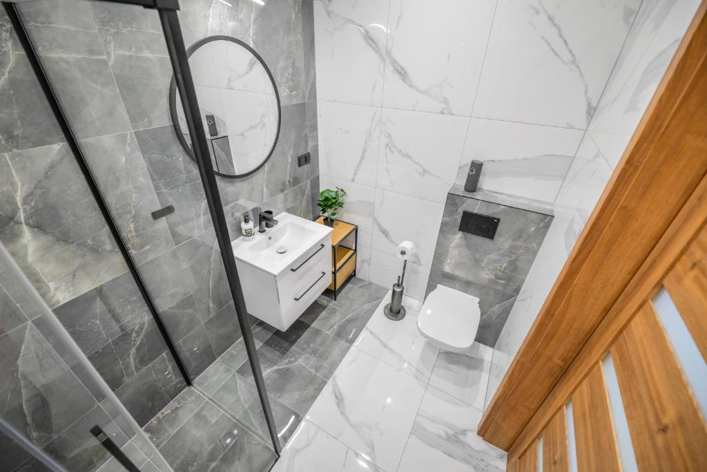 Kúpeľňa v ubytovaní Apartament Komfort 17