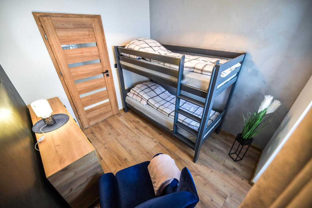 Posteľ alebo postele v izbe v ubytovaní Apartament Komfort 17