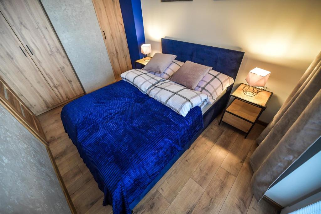 Posteľ alebo postele v izbe v ubytovaní Apartament Komfort 17