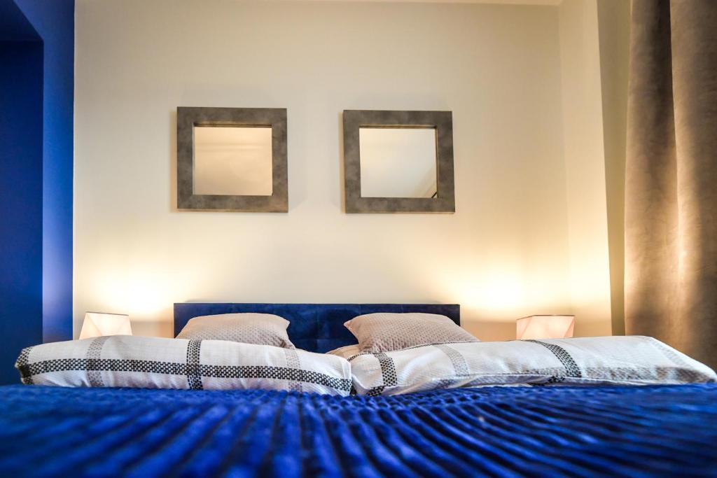 Posteľ alebo postele v izbe v ubytovaní Apartament Komfort 17