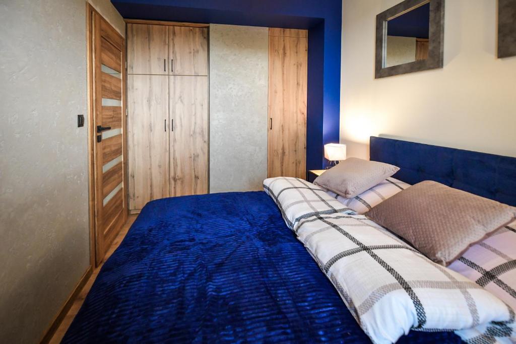 Posteľ alebo postele v izbe v ubytovaní Apartament Komfort 17