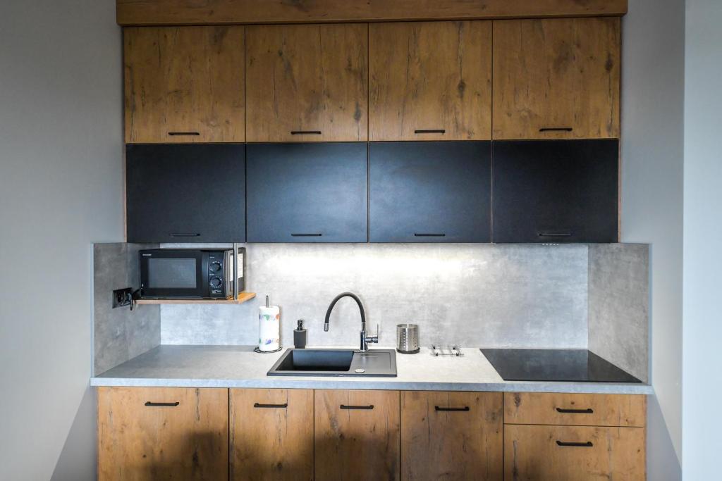 Kuchyňa alebo kuchynka v ubytovaní Apartament Komfort 17
