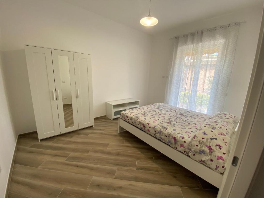 מיטה או מיטות בחדר ב-La casa di Elia e Italo