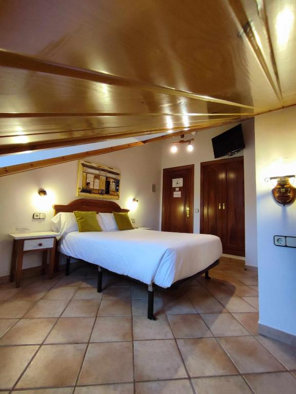Postel nebo postele na pokoji v ubytování Hotel Rural LAbadia de Sieste