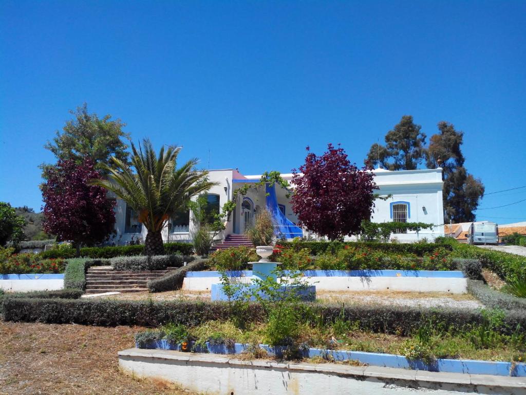 a house with a garden in front of it at Hotel Casa Grande in Constantina